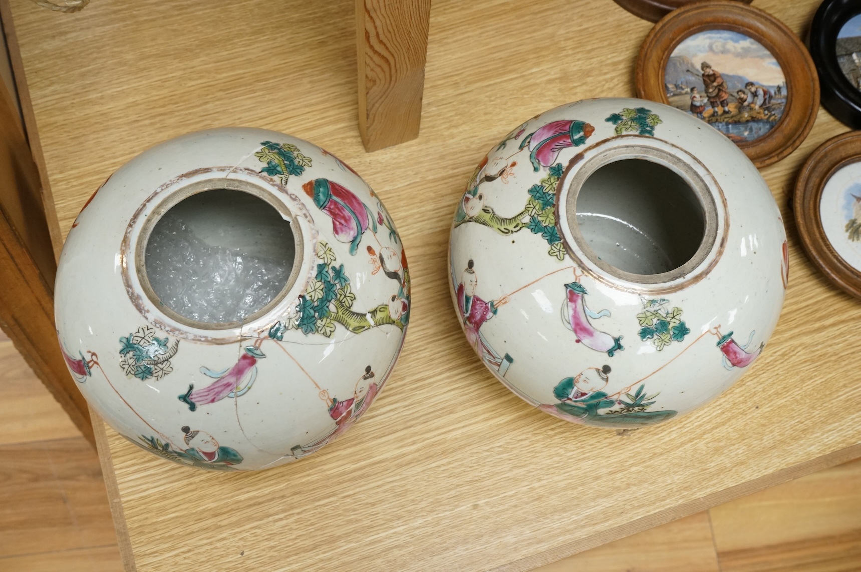 A pair of late 19th century Chinese famille rose jars, without covers, 19cm high.